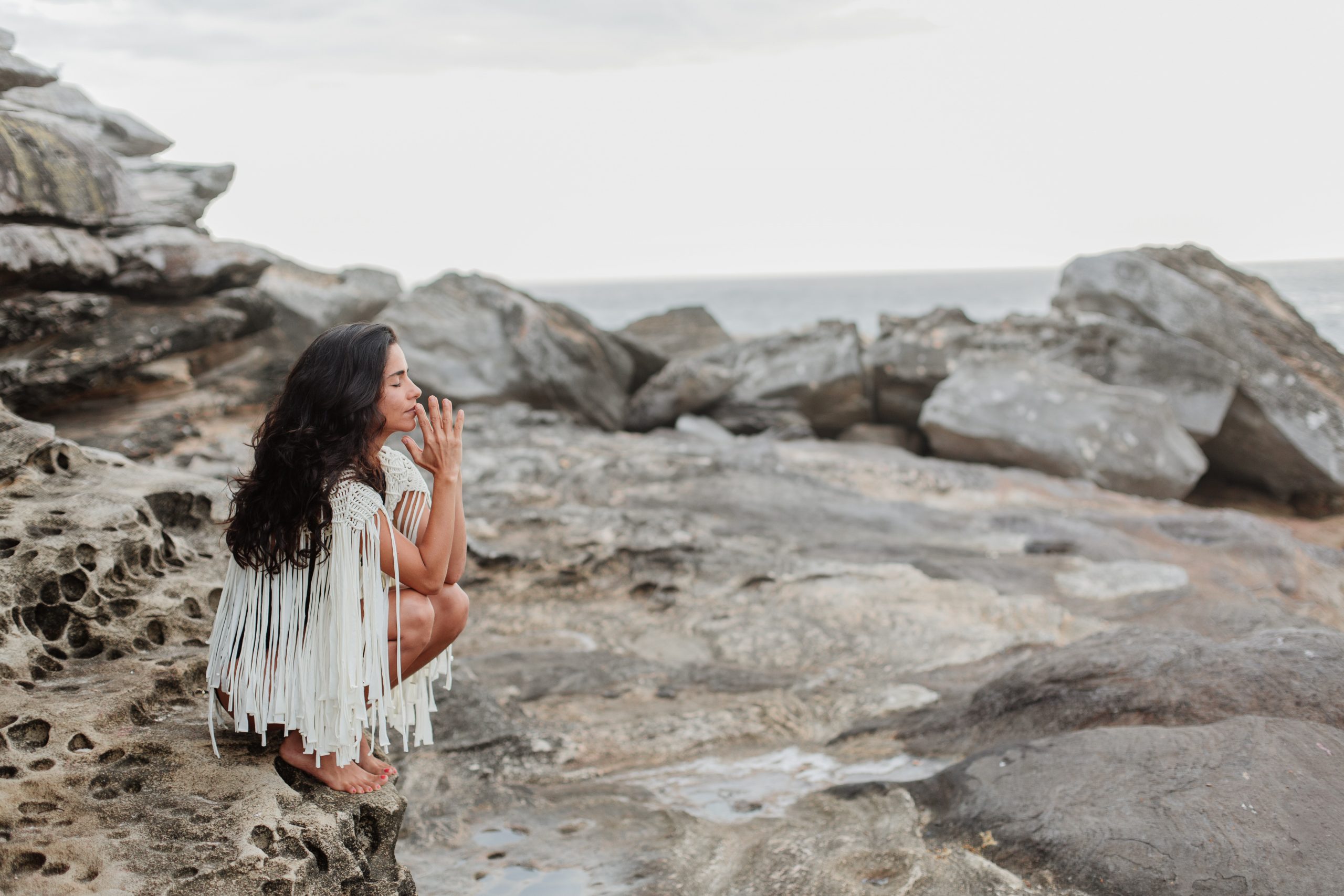 photo-of-woman-sitting-on-rock-3326365